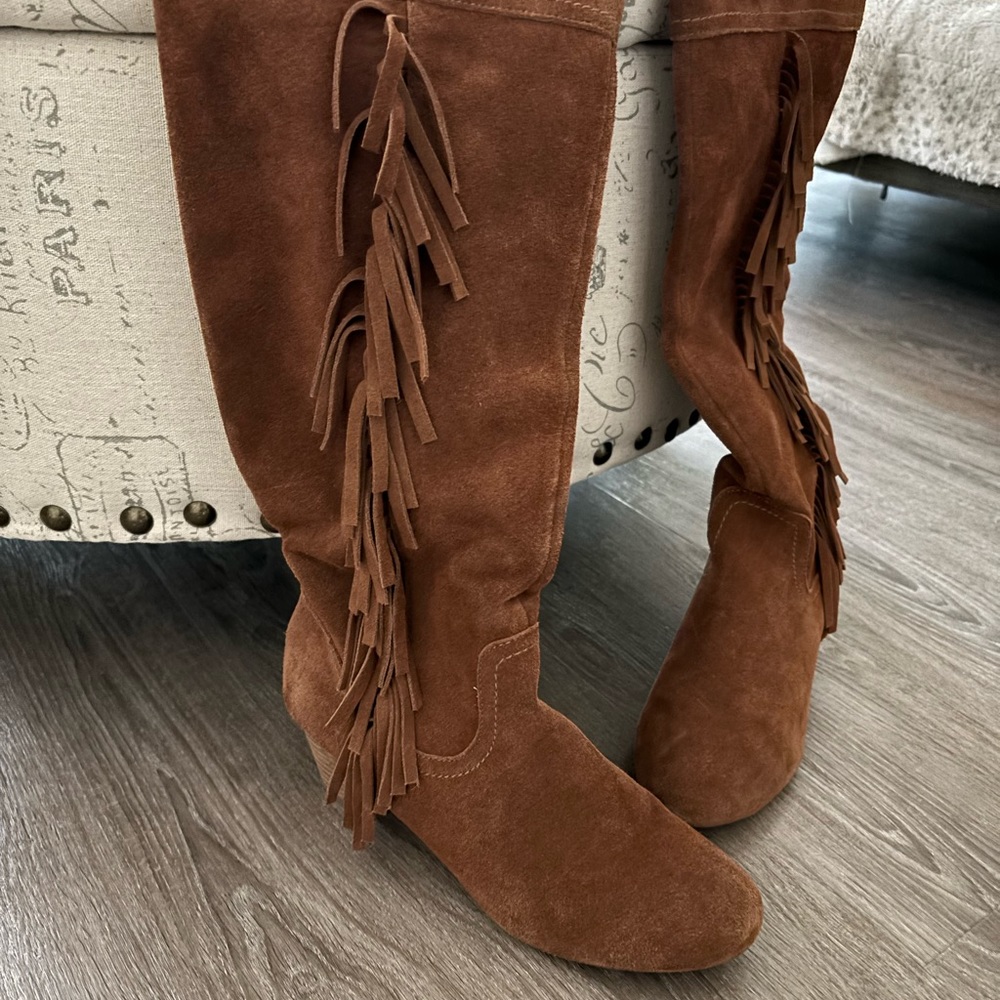 Suede knee high boots.